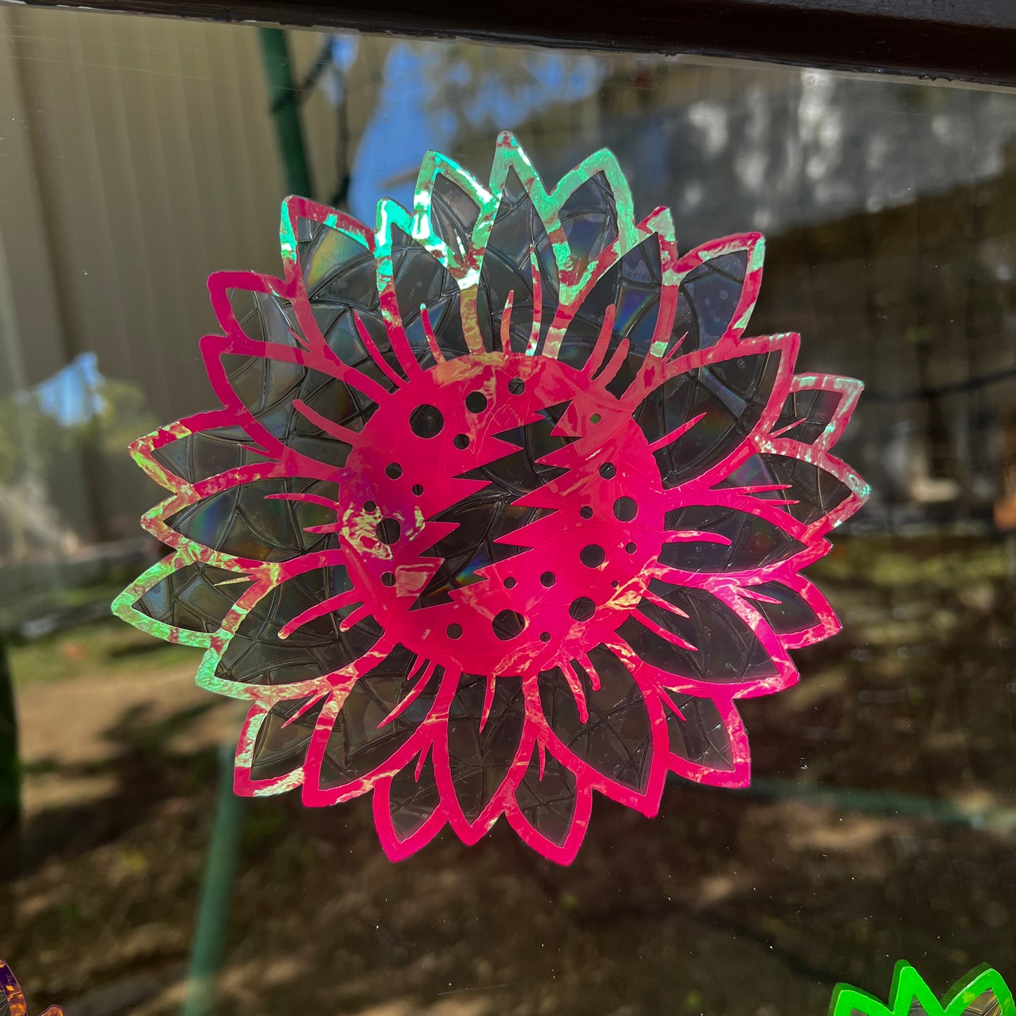 Iridescent sunflower bolt window clings